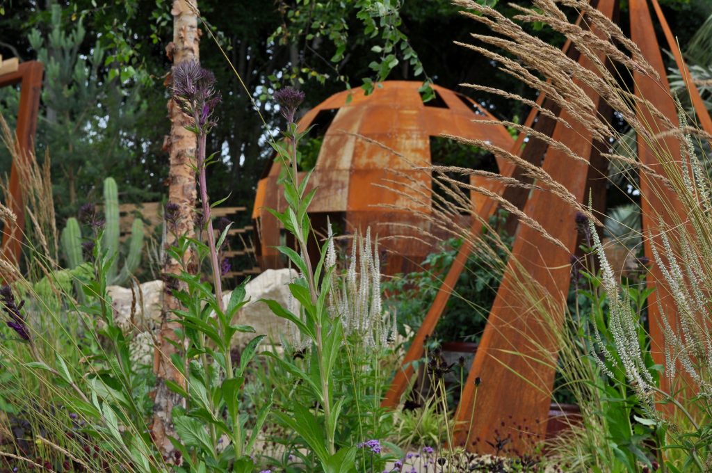 Garden deck with custom-built seating and decorative pond