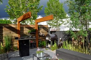 Outdoor kitchen and dining area in a luxury garden