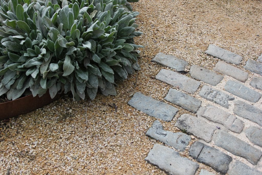 grey cobbles set in yellow gravel