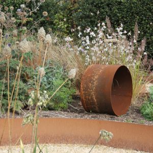 garden rockery and rusty pipe