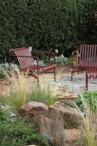 red chairs on garden patio