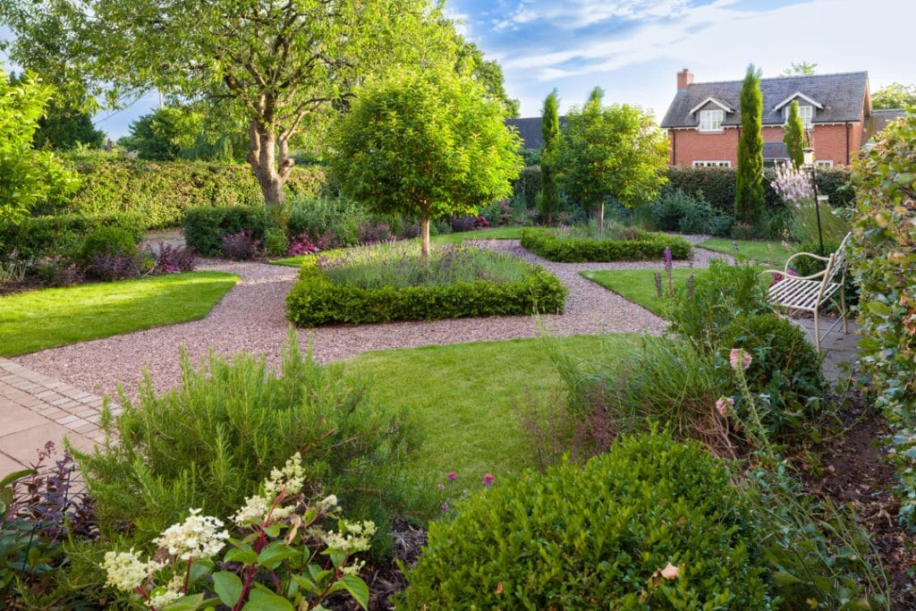 Jane bingham garden with neat lawns and considered planting